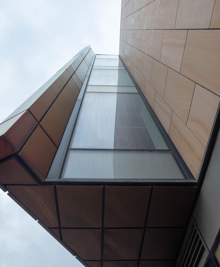 A person practicing in a minimalist and clean living room.